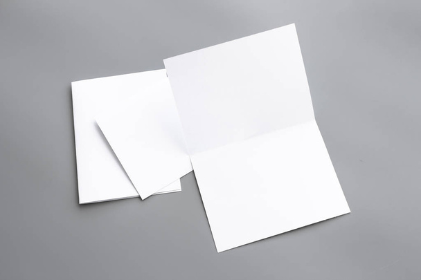 Blank portrait A4. brochure magazine isolated on gray, changeable background / white paper isolated on gray - Foto, afbeelding