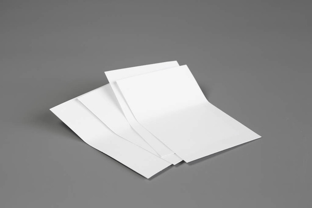 Blank portrait A4. brochure magazine isolated on gray, changeable background / white paper isolated on gray - Foto, afbeelding