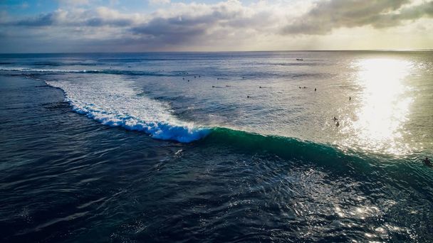 Surfer ride on waves in ocean sunset, top view - Fotó, kép