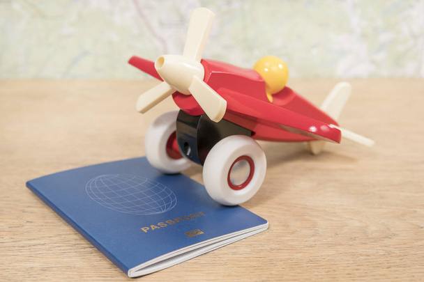 toy plane and passport on the table - Foto, Imagem
