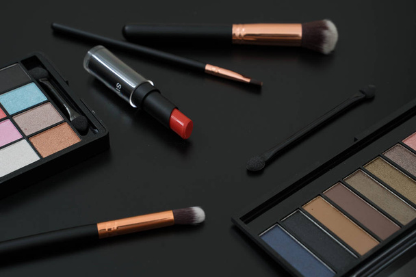 make up  and brushes  on black background - Фото, изображение