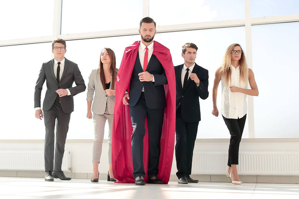 business team and their leader are marching in the office lobby - Fotoğraf, Görsel