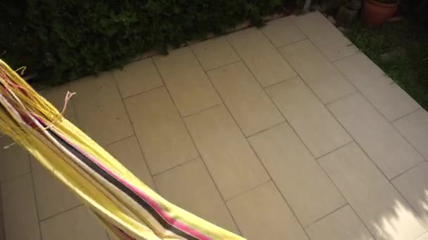 Girl swinging and having fun in hammock - Footage, Video
