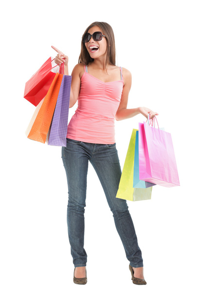 Shopping woman pointing full body isolated - Photo, Image
