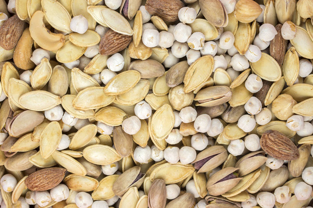 Peanuts, walnuts, almonds, hazelnuts and cashews mixed together - 写真・画像