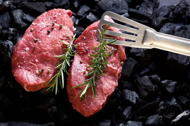 Beef steak on the charcoal. - Фото, изображение