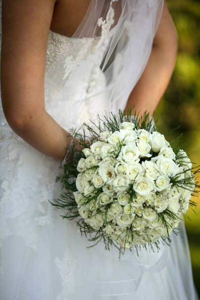 Wedding bouquet. Bride's flowers. Bridal flowers, wedding concept photo.  - Фото, изображение