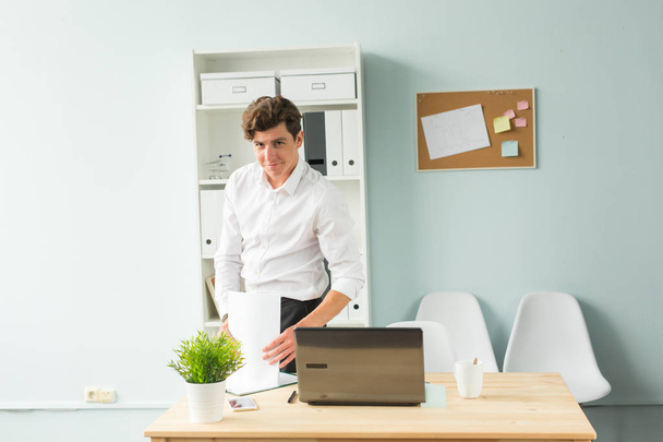 Business people, fool and joke concept - young handsome man in the office - Photo, Image