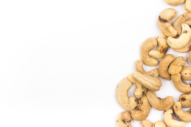 Cashew nuts frame over a white background - Fotografie, Obrázek