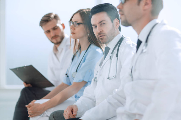 Doctors listen during an office meeting - Foto, imagen