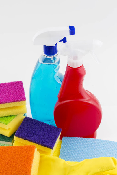 Cleaning products with cleaning material, isolated on white - 写真・画像