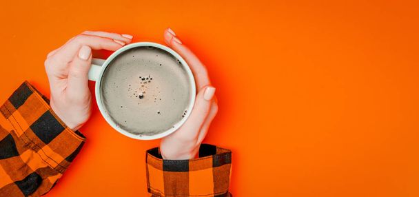 Female hands holding warm cup of coffe - 写真・画像