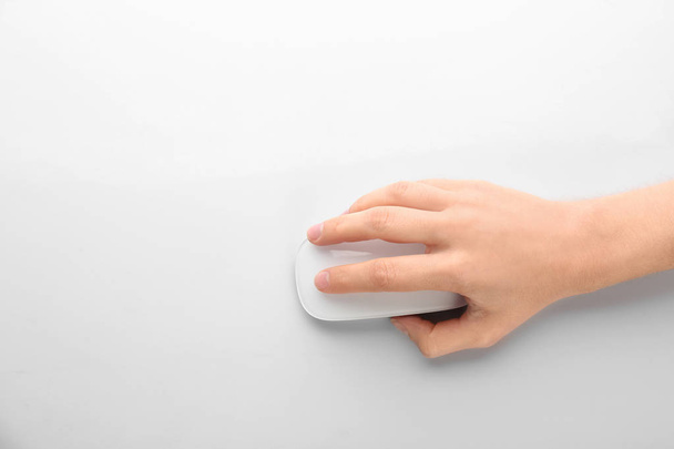 Woman using computer mouse on white background, top view. Space for text - Foto, immagini