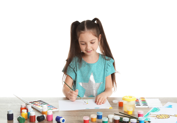 Cute child painting picture at table on white background - Photo, Image