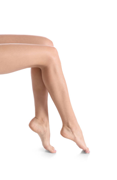 Woman with beautiful legs and feet on white background, closeup. Spa treatment - Foto, Imagen