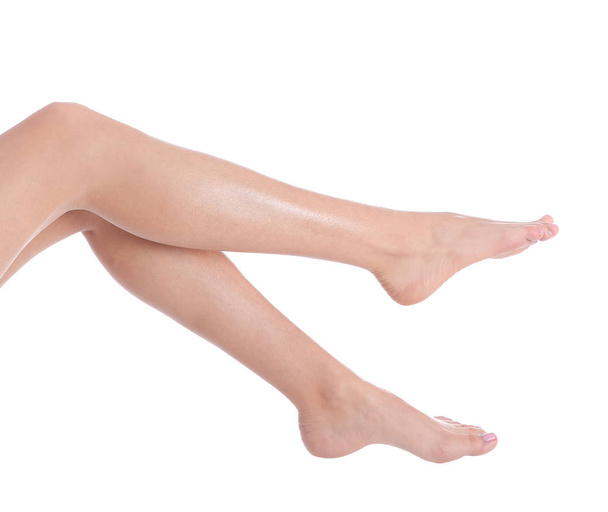 Woman with beautiful legs and feet on white background, closeup. Spa treatment - Fotografie, Obrázek