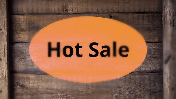 Hot sale burning text with smoke on wooden background. Sales promotional animation video - Photo, Image