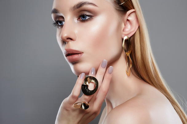 jewelry on beautiful girl with blue eyes. young blonde woman with make-up and jewels accessories. Beauty Fashion Portrait - Fotó, kép