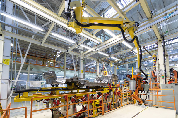process of welding cars. Modern Assembly of cars at plant. automated build process of car body - Photo, Image