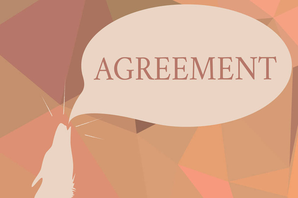 Writing note showing Agreement. Business photo showcasing harmony or accordance in opinion or feeling negotiated positively Contour shape of Wolf Head Pointing upward Speech Bubble. - Photo, Image
