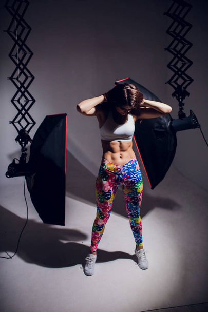 Figure sports girl on black background - Zdjęcie, obraz