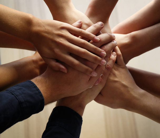 People putting hands together, closeup. Unity concept - Photo, Image