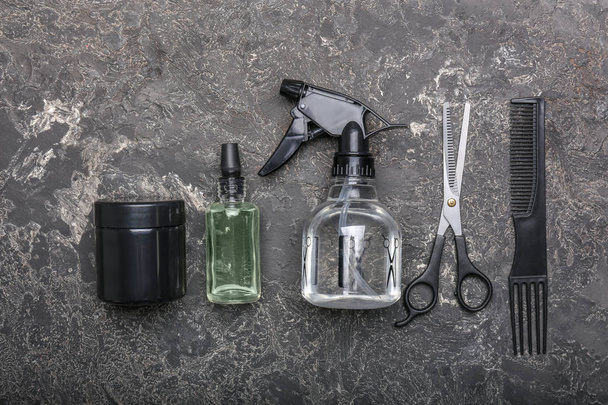 Barber accessories on grunge background, flat lay - Foto, afbeelding