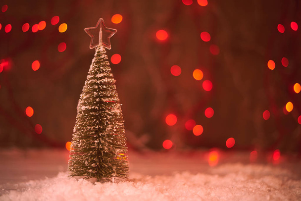 close up view of christmas tree decorated by beautiful star  - Foto, afbeelding