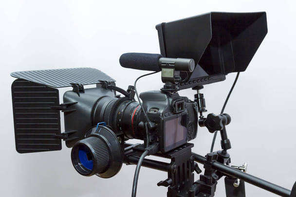 Camera equipment for shooting video and sound recording fixed on a tripod - Photo, Image