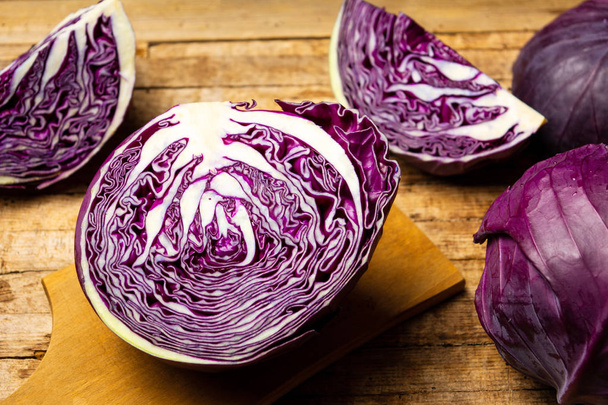 Purple cabbage on a rustic wooden table top view - Photo, Image