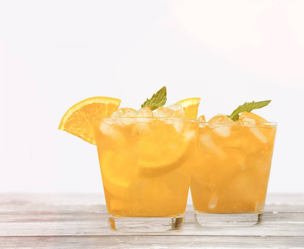 cold drink, ice tea cocktail in two glasses  - Foto, Imagem