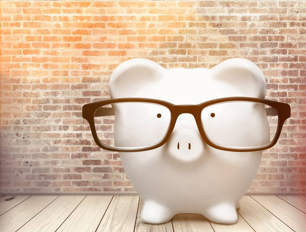 Piggy bank in glasses, investment and saving concept - Фото, зображення
