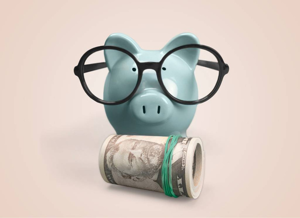 piggy bank and  money on background - Foto, afbeelding