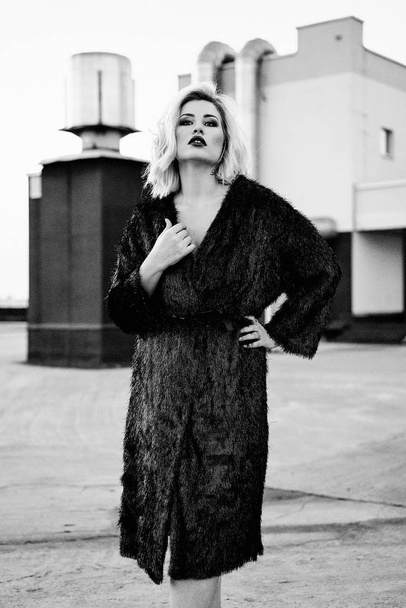 gorgeous young blond woman in fur coat  - Φωτογραφία, εικόνα