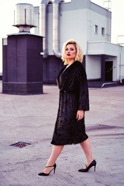gorgeous young blond woman in fur coat  - Fotoğraf, Görsel
