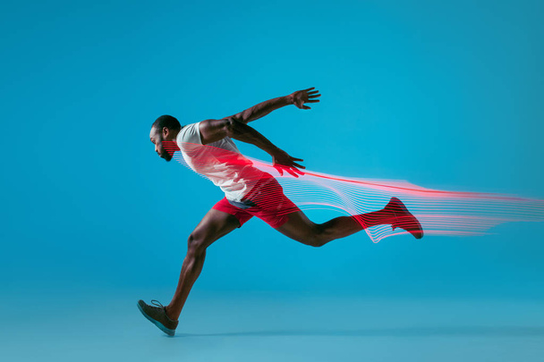 Full length portrait of active young muscular running man, - Valokuva, kuva