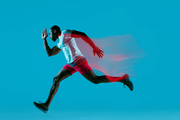 Full length portrait of active young muscular running man, - Valokuva, kuva