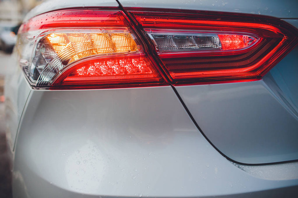 taillight back light with brilliant reflections auto white body - 写真・画像