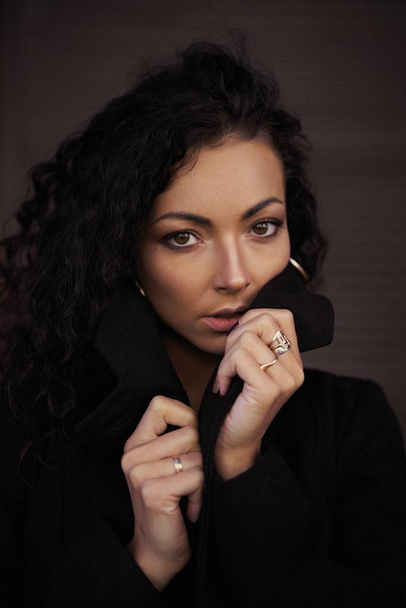 portrait of beautiful young woman with darc curly hair       - Zdjęcie, obraz