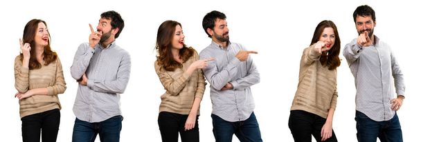Set of Young couple pointing to the lateral, up and front - Фото, зображення