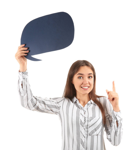 Young woman with raised index finger and blank speech bubble on white background - Фото, изображение