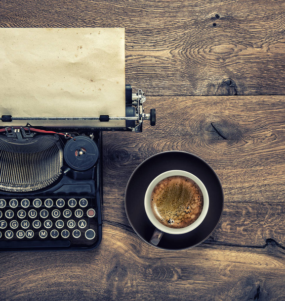 Vintage typewriter with grungy paper page and black coffee. Retro toned - Fotoğraf, Görsel