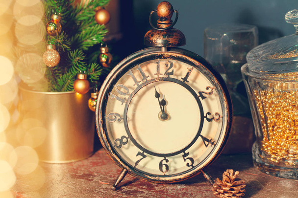 Composition with retro alarm clock and Christmas decorations - 写真・画像