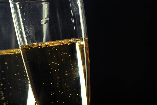 Champagne glasses for festive occasion against a dark background - Foto, imagen