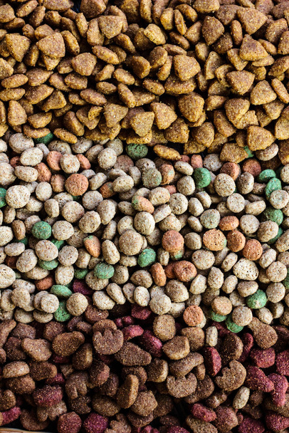 Top view of dry pet food background. - Фото, изображение