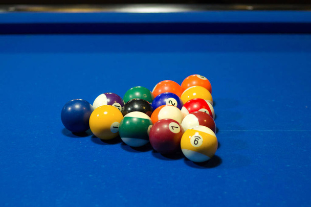 Billiard pool game in progress, balls in starting triangular position - Photo, Image