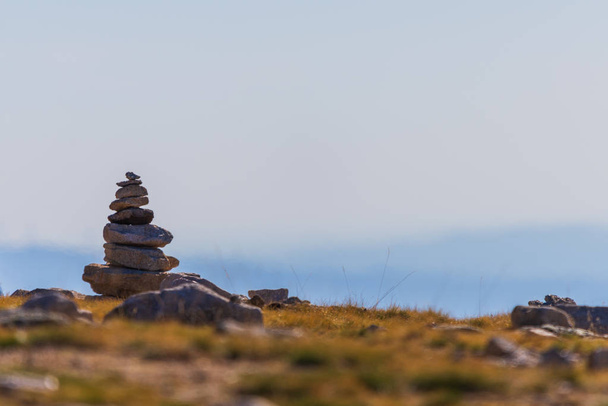 Zen balanced stones stack in high mountains. Scenic mountain view - Photo, Image
