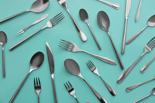 Set of cutlery on color background, flat lay - Fotó, kép