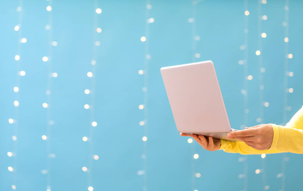Woman holding a laptop computer - Φωτογραφία, εικόνα