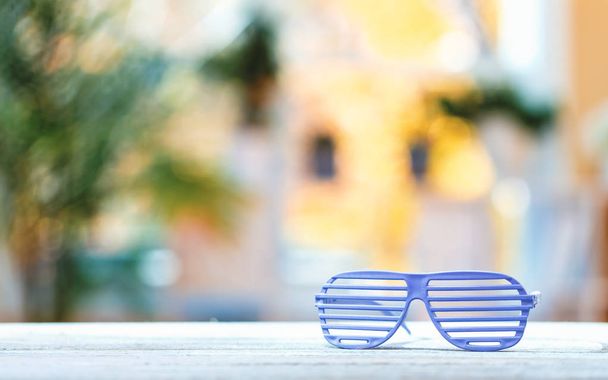 Shutter shades glasses on a bright background - Φωτογραφία, εικόνα